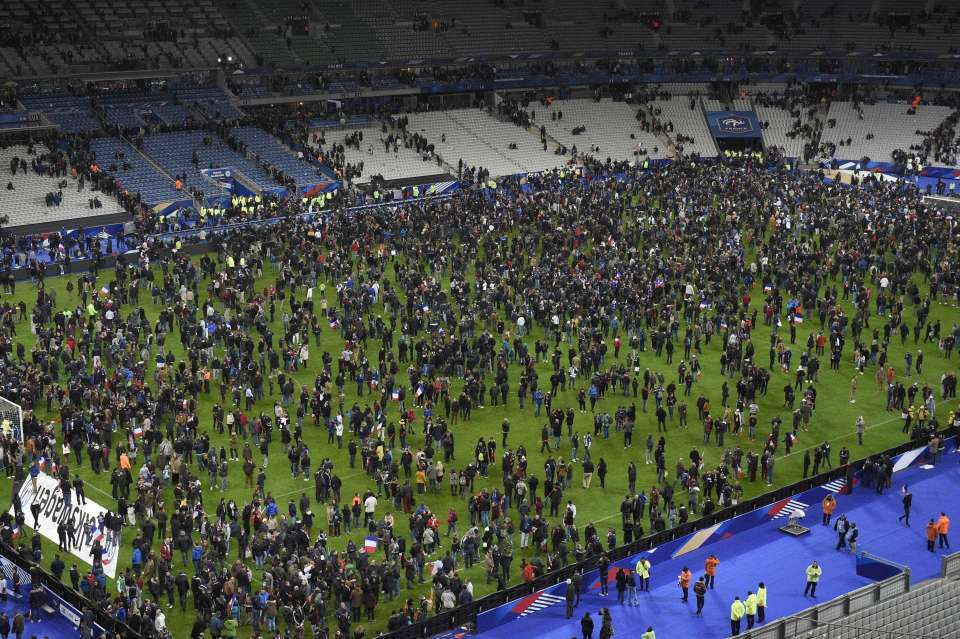 Spectators gather on the pitch of the Stade de France stadium following the friendly football match between France and Germany in Saint-Denis, north of Paris, on November 13, 2015, after a series of gun attacks occurred across Paris as well as explosions outside the national stadium where France was hosting Germany. At least 18 people were killed, with at least 15 people killed at the Bataclan concert hall in central Paris, only around 200 metres from the former offices of Charlie Hebdo which were attacked by jihadists in January. AFP PHOTO / FRANCK FIFEFRANCK FIFE/AFP/Getty Images