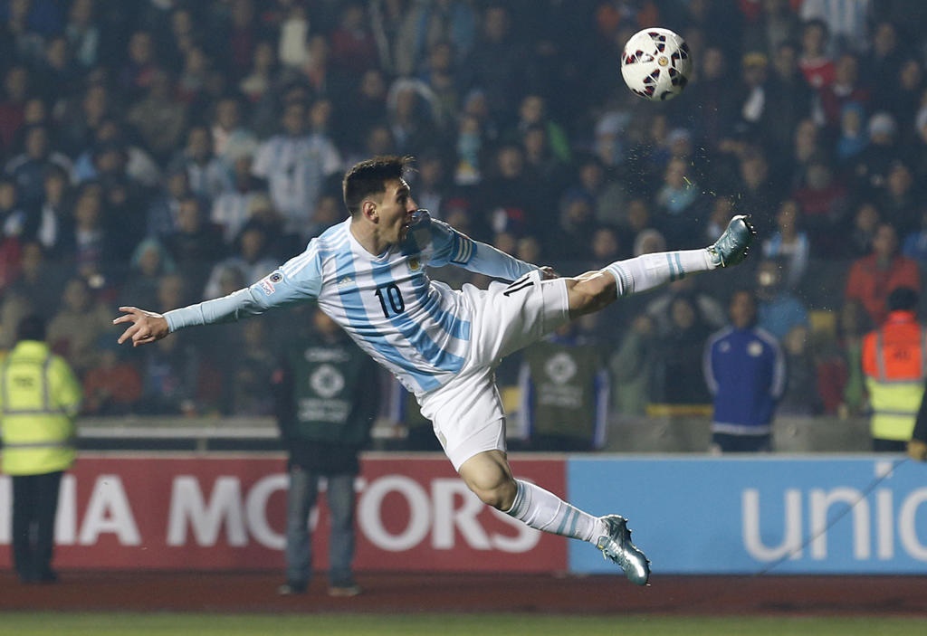 FILE - In this June 30, 2015, file photo, Argentina's Lionel Messi kicks the ball during a Copa America semifinal soccer match against Paraguay at the Ester Roa Rebolledo Stadium in Concepcion, Chile. (AP Photo/Silvia Izquierdo, File)