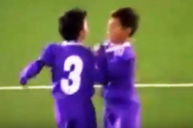 Young Byron celebrates with a team-mate after scoring for Under-8s