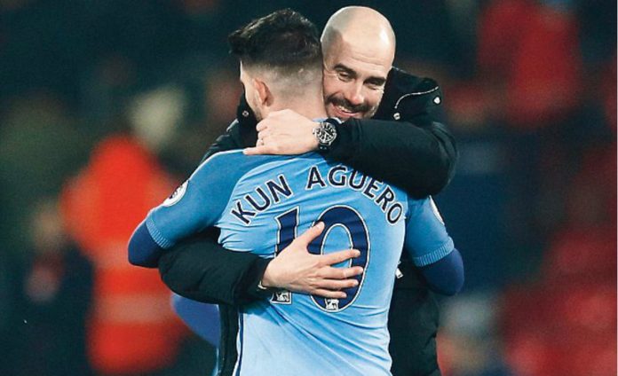 pep hugs aguero