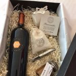 Gift-bag-for-guests-at-soccer-star-Lionel-Messis-wedding-with-wine-local-desert-dulce-de-leche-and