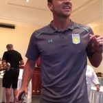 John Terry laughs along while he sings on stage at his Aston Villa initiation