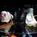 The ‘CR7’ brand is shown on the back of the shimmering silver glitsy boots