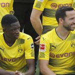 Dembele sits alongside team-mate Gonzalo Castro on Wednesday