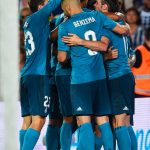 Real Madrid celebrate after Pique’s unfortunate own-goal gave them the lead in the second half