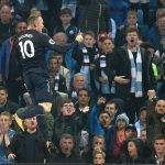 Wayne Rooney jumps in celebration