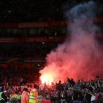 A red flare set off by the rowdy Cologne fans during the Europa League clash