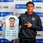 Arsenal’s Alex Iwobi shows off his player card