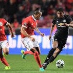 Marcus Rashford attempts to go past the Benfica defence down left side