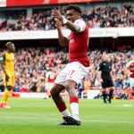 Nigeria international Alex Iwobi celebrates after doubling Arsenal’s lead against Brighton