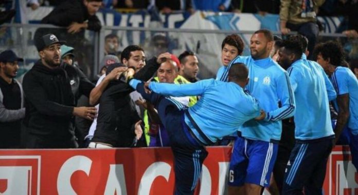 Patrice-Evra-was-sent-off-after-appearing-to-kick-a-fan-before-the-match