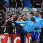 Patrice Evra was sent off after appearing to kick a fan before the match