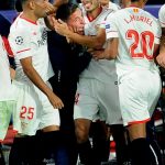 Sevilla players rushed to celebrate their late equaliser with their manager