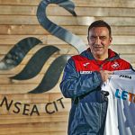 Carvalhal poses with the Swansea shirt after being named the new manager
