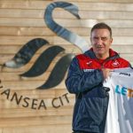 Carvalhal poses with the Swansea shirt after being named the new manager