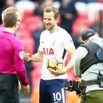 Harry Kane collects his matchball after the game