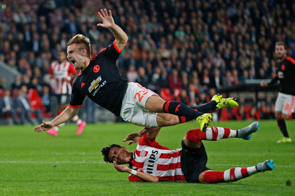 PSV's Hector Moreno lunges into Luke Shaw leading to an awkward landing
