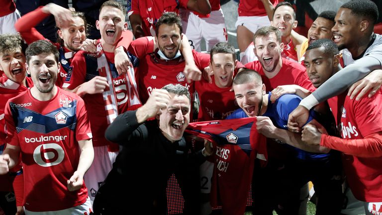 Christophe Galtier ce;ebrates with Lille players after winning Ligue 1